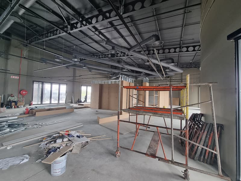 Mobile scaffold in place for ceiling and services installation in a retail space