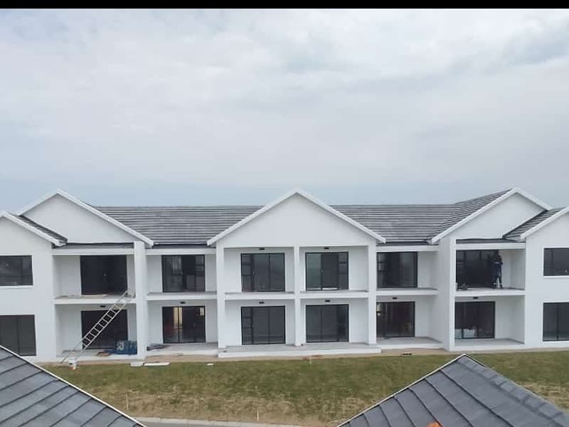 Completed multi-unit residential block, plastered and painted