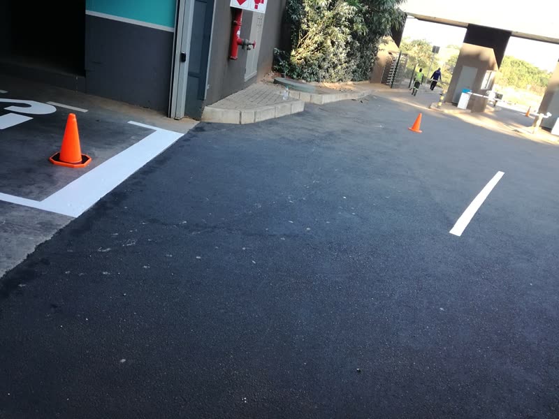 Newly laid asphalt surfacing with white line marking set out