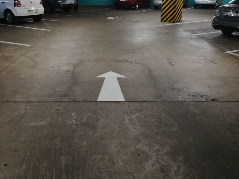 Completed customer parking deck in use with bays and directional markings