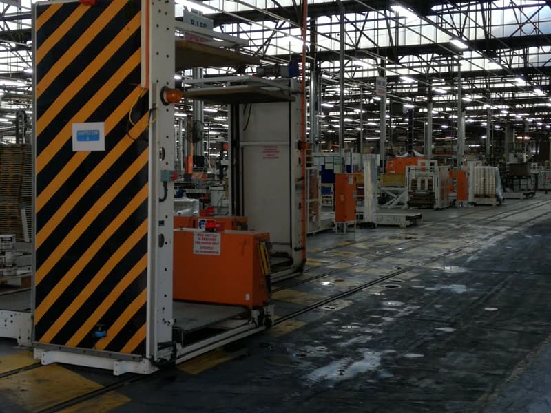 Working factory floor with production machinery and marked traffic routes