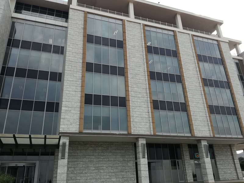 Completed multi-storey office building with banded glazing