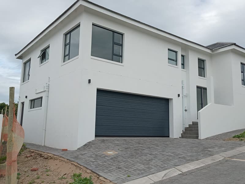 Completed double-storey home with a double garage and paved driveway